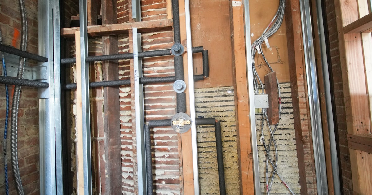 Contractor using AI to automate project estimates and job scheduling on tablet